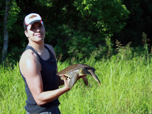 eric holding an adult softshell turtle apalone spinifera
